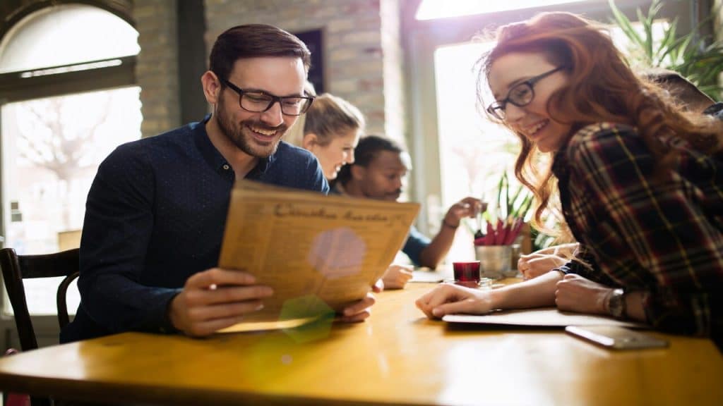 A couple looking at the menu