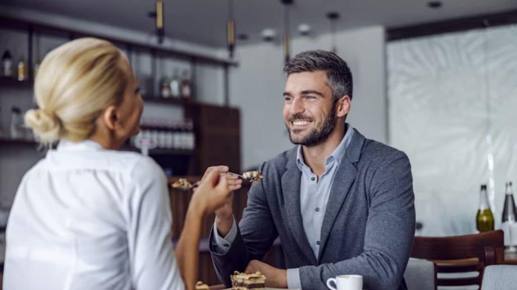Couple smiling while engaged in deep conversation