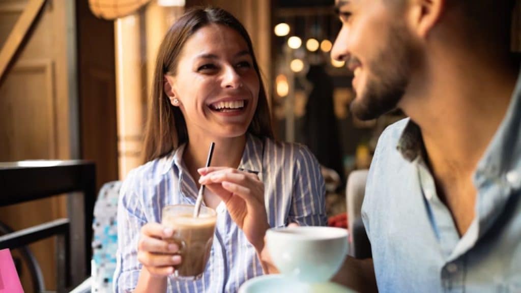 Couple seated comfortably at a cozy café