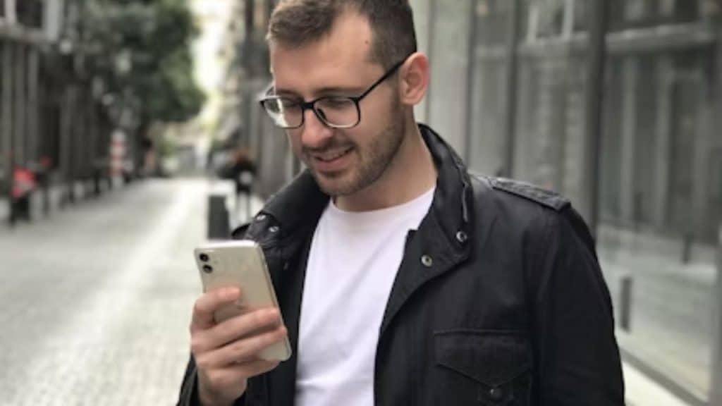 Man texting after a date with a smile
