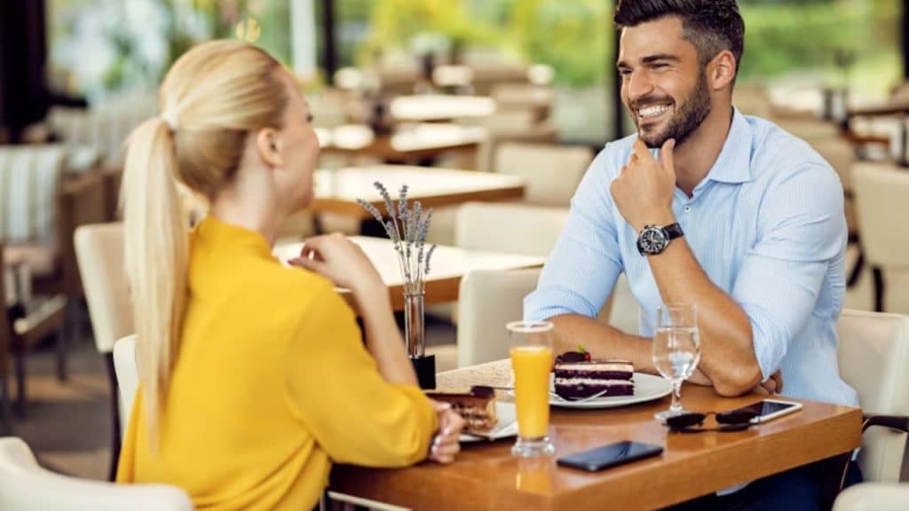Man smiling confidently during a date