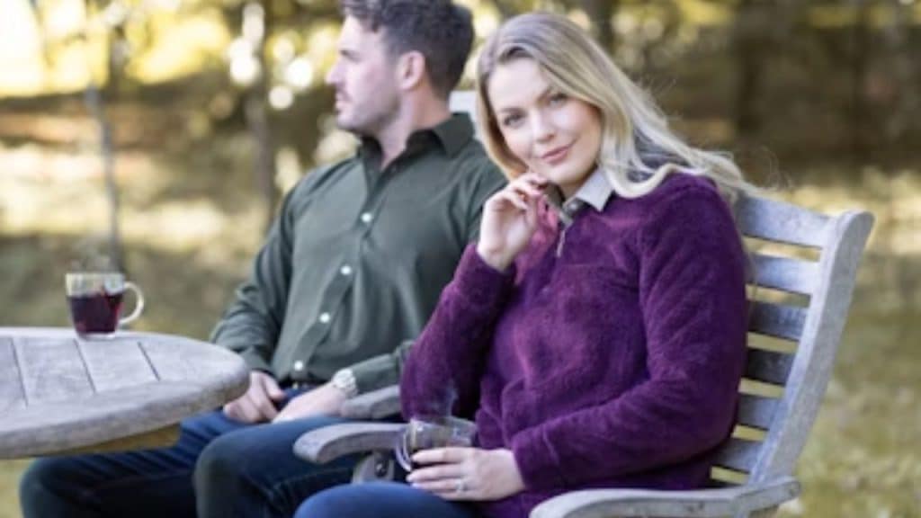 Man sitting with wife, with distant eyes