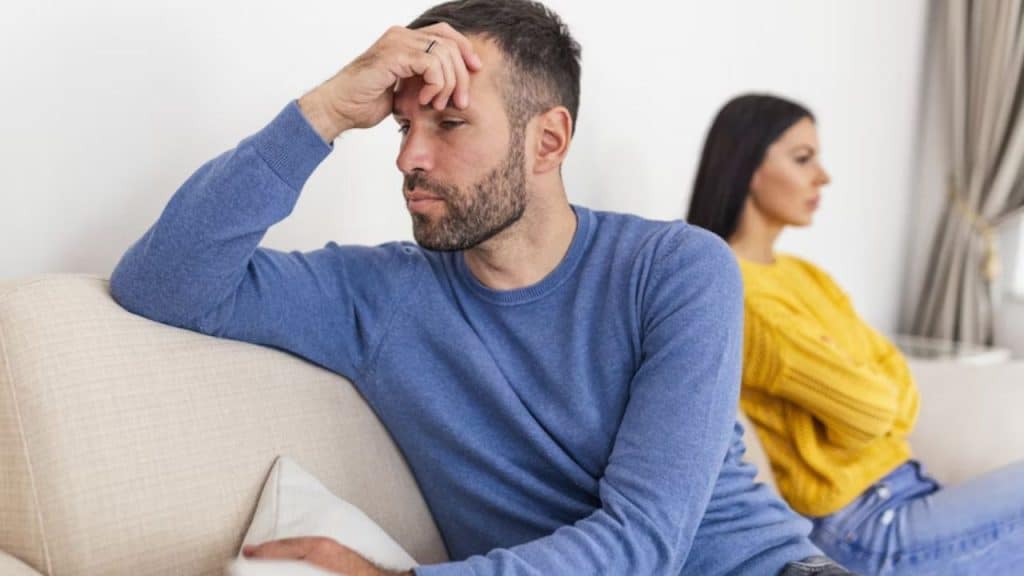 Man looking frustrated while arguing with partner