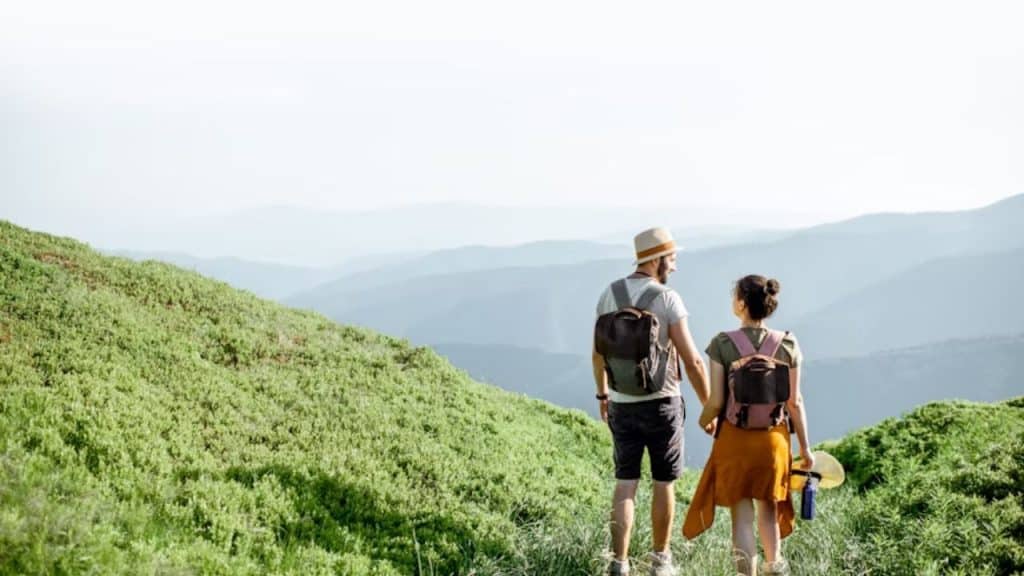 Couple hiking a scenic mountain trail together