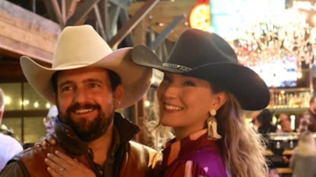 Couple dressed in cowboy outfit while dancing