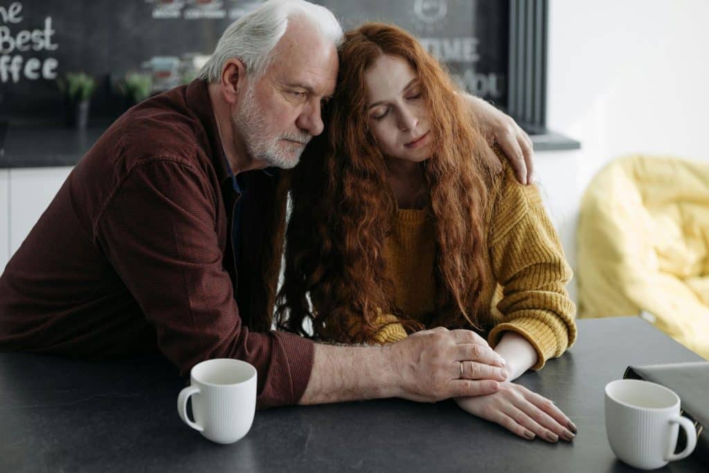 A man listening to woman 