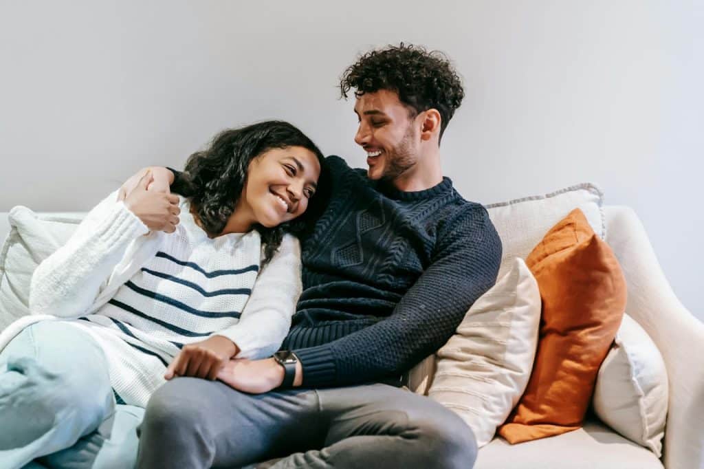 A man and woman at the couch