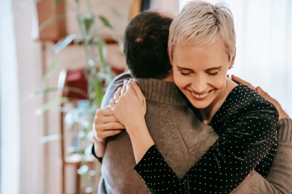 A man and woman hugging