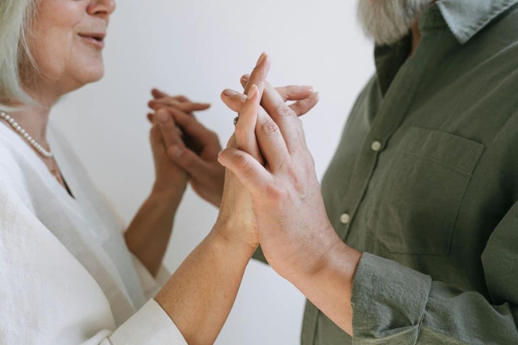 A man and woman holding hands