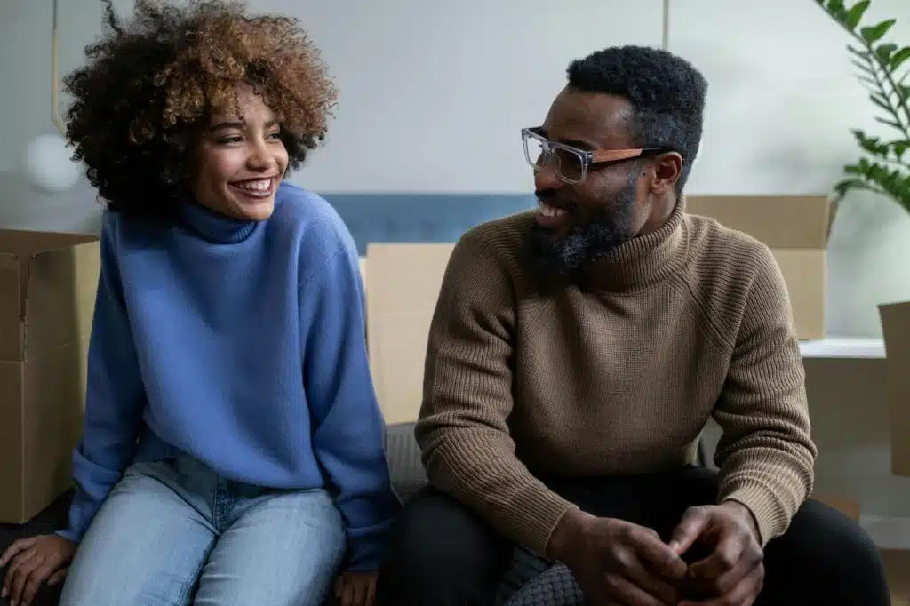 A man and woman laughing together 