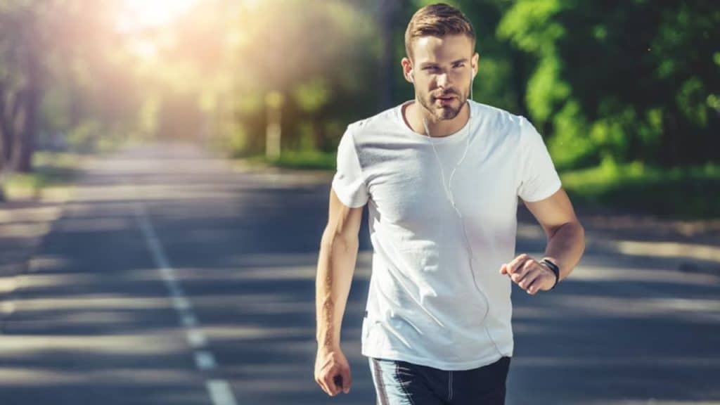 Man jogging in the early morning with determination