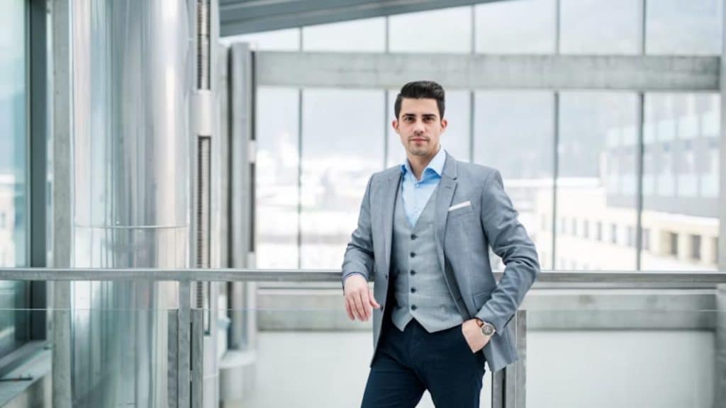 Mature man in well fitted clothing standing confidently