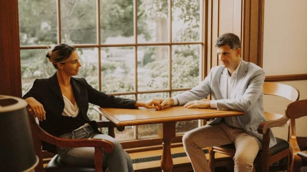Couple having a serious but calm discussion indoors