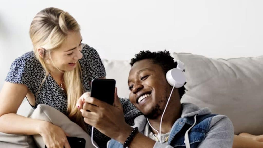 Couple sharing music playlists with each other