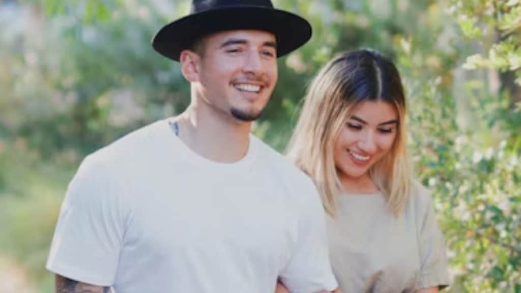 Couple smiling while walking together outdoors