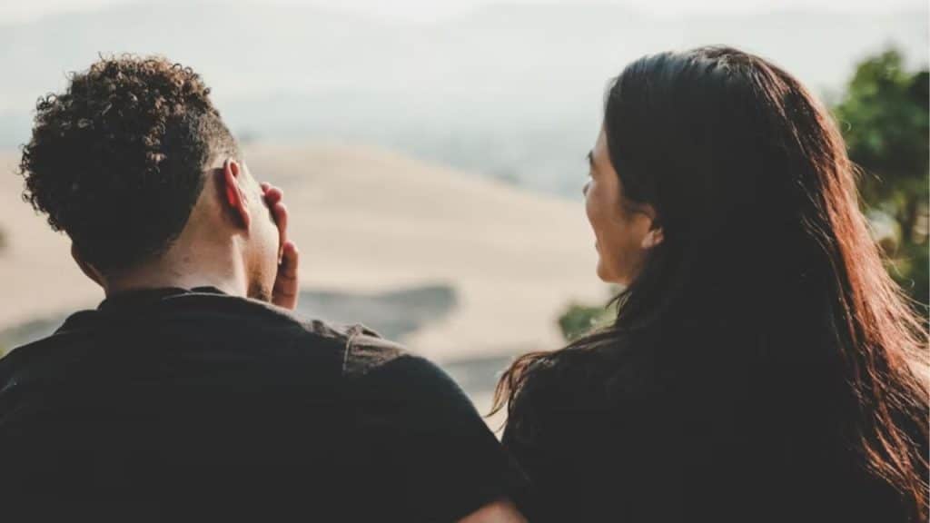 Man calmly explaining his perspective to his partner