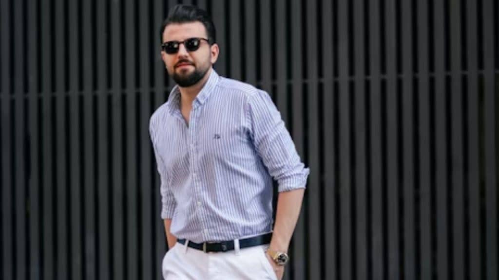 Mature man in sharp, modern clothing walking outdoors
