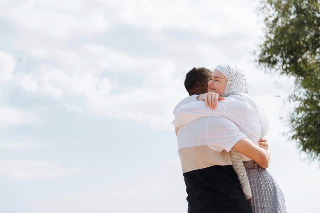 A man and woman hugging 