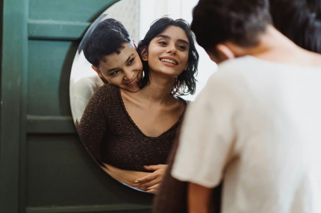 A woman looking at the mirror 
