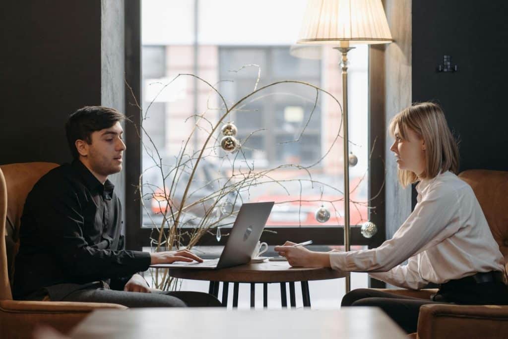 A man and woman talking about financial stability