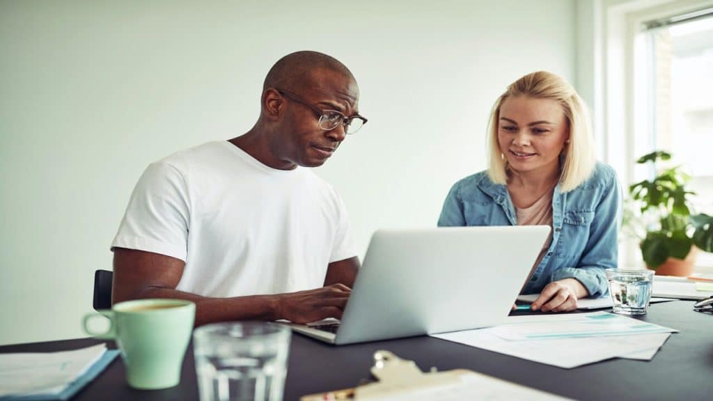 A couple talking and working together