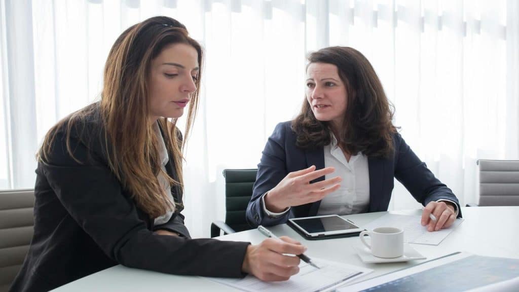 Colleagues talking at work