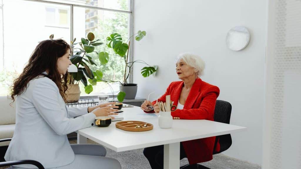 Female colleagues talking at work