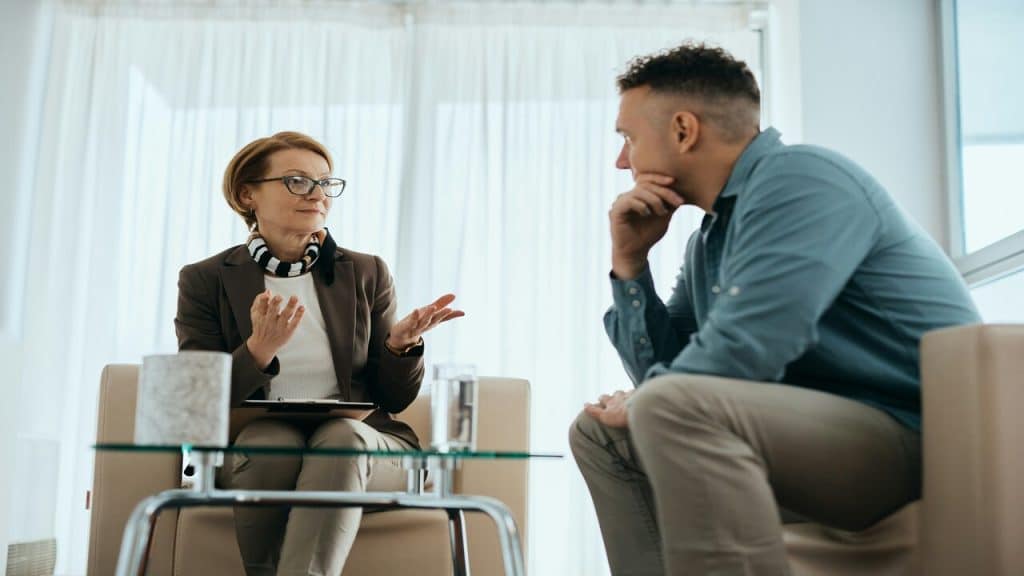 Colleagues talking at a lounge