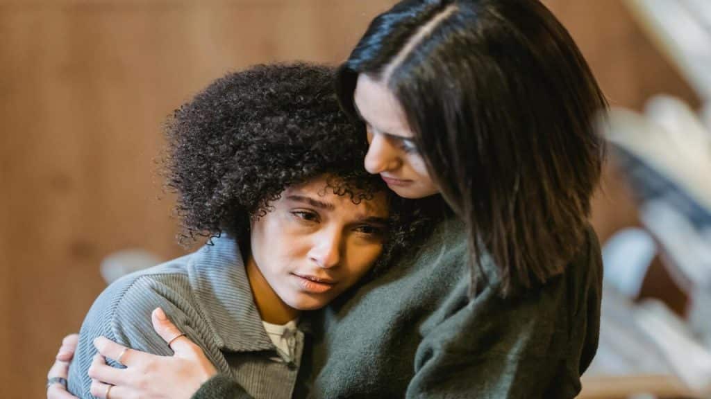 Friends reconciling after a fight