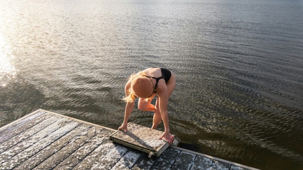 A woman about to swim in the morning