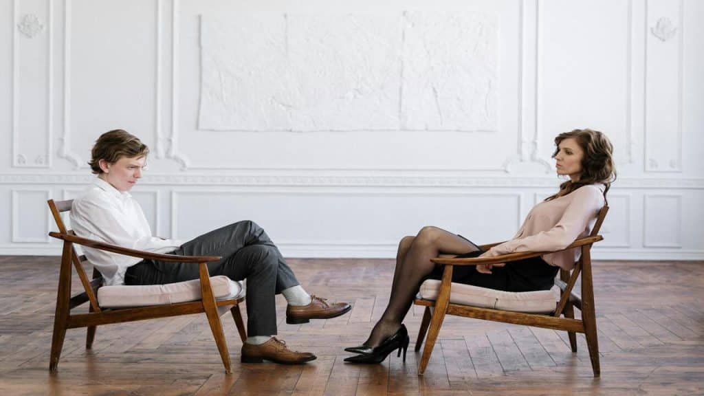 A couple talking in the living room