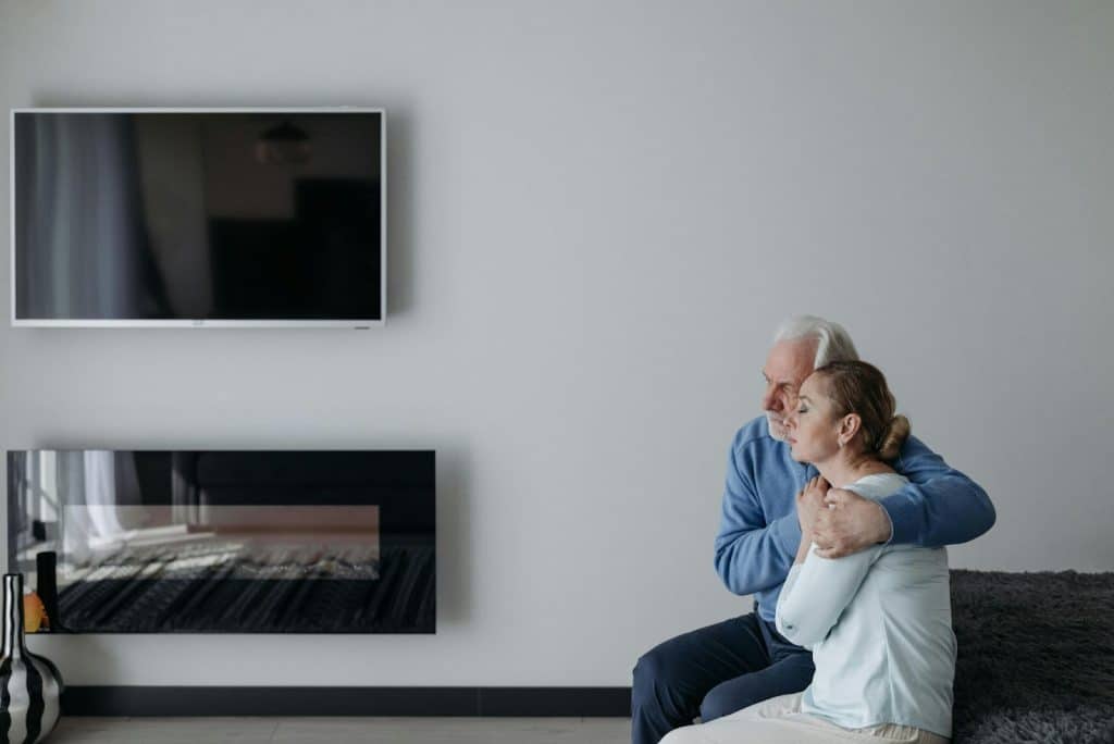 A man comforting a woman