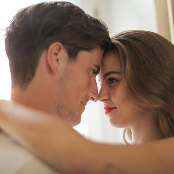 A man and woman facing each other