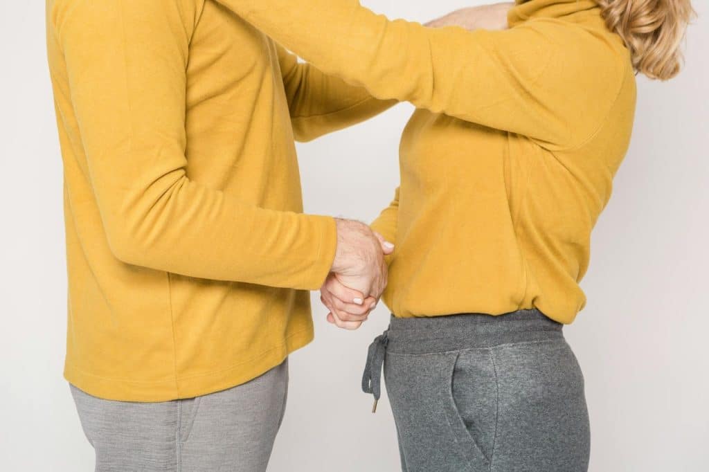 A man and woman facing each other