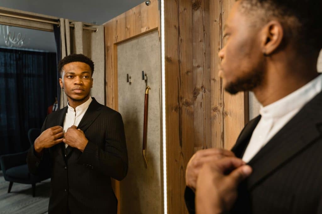 A man looking at the mirror