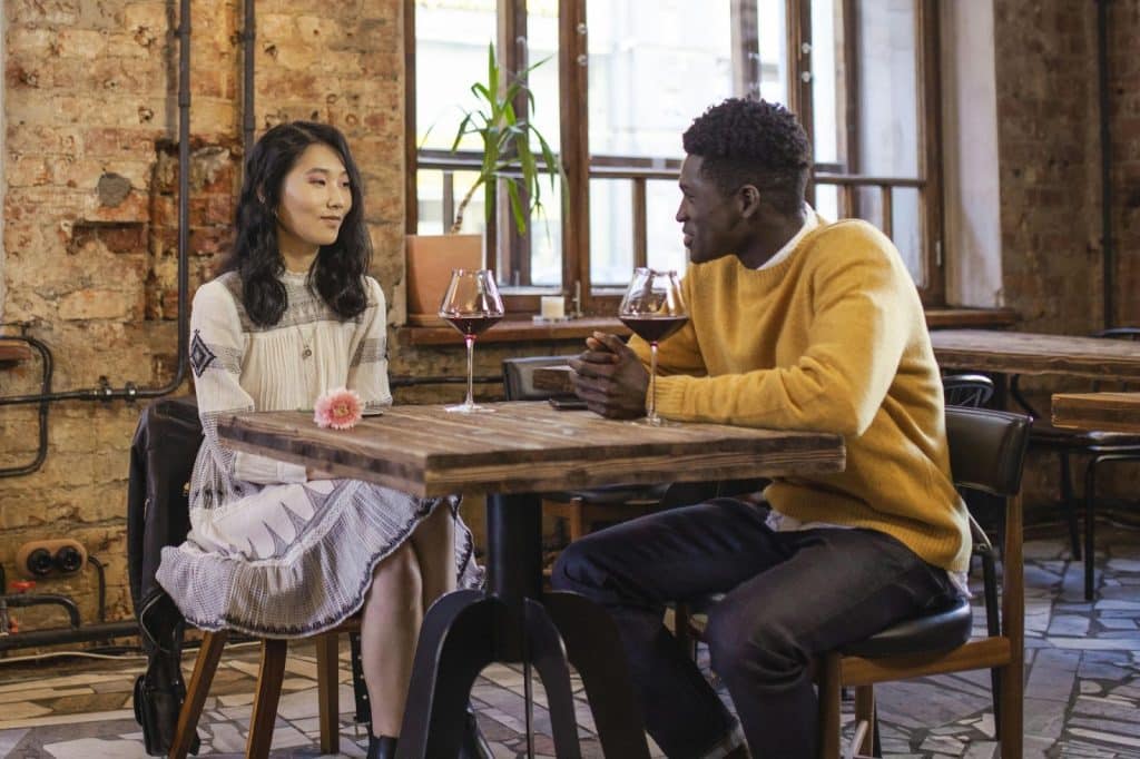 A man telling a story to a woman