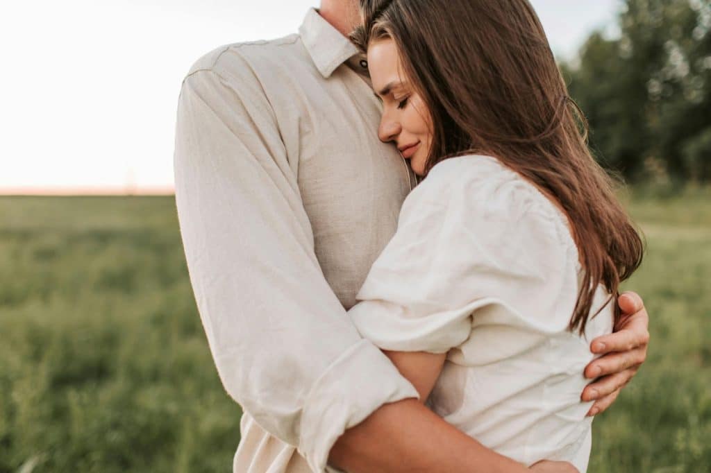A man hugging a woman