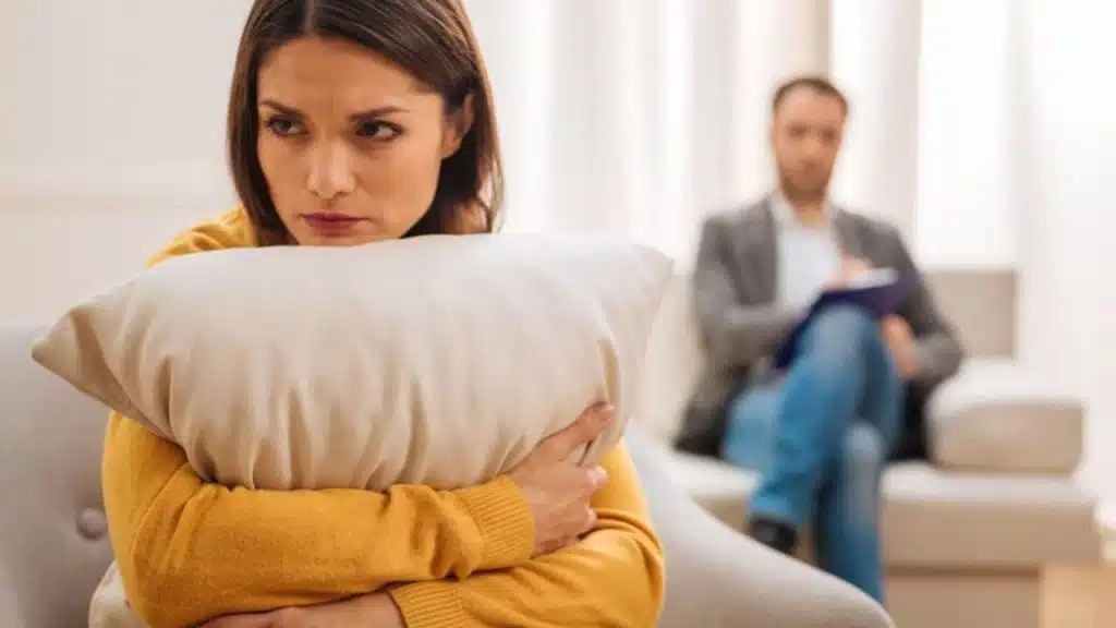 A wife rolling her eyes as her husband talks