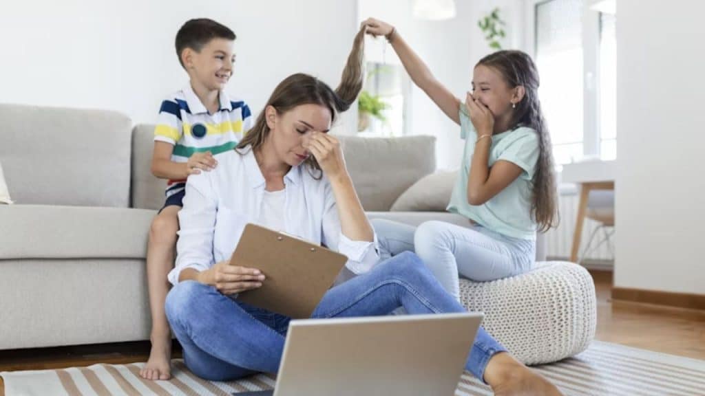 A wife looking tired while family goes on around her