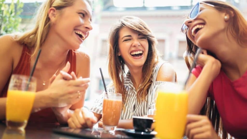 A woman feeling happier around her friends than her partner