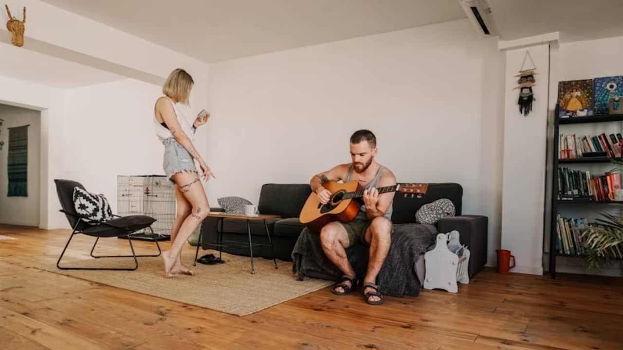 Couple respecting personal space while sharing the same room.