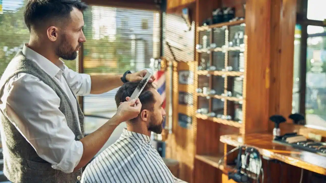 Man having a haircut prioritizing grooming.