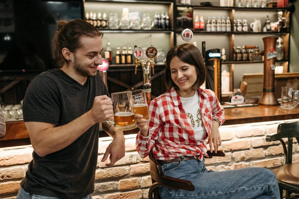 A man and woman at the bar counter 