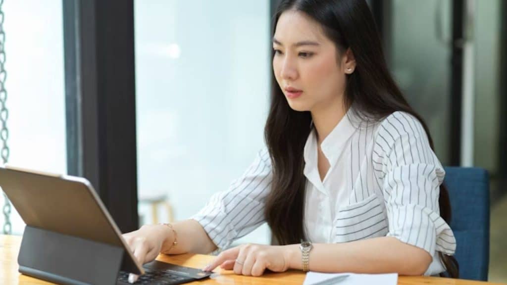 Professional woman working at her desk with focus and confidence