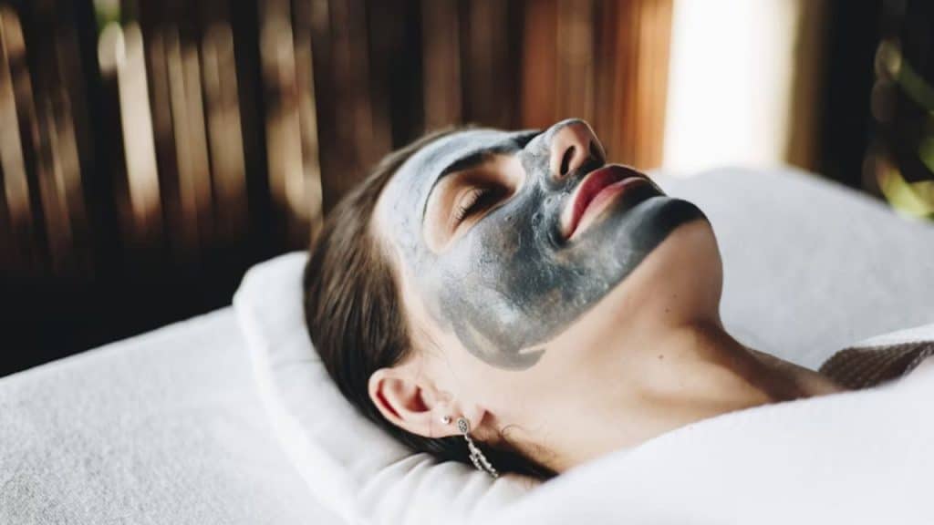 Woman enjoying a spa day with a face mask