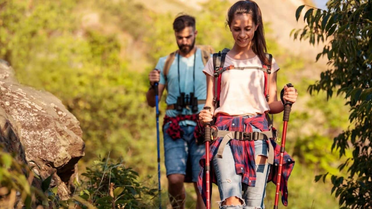 Couple hiking a mountain trail together.