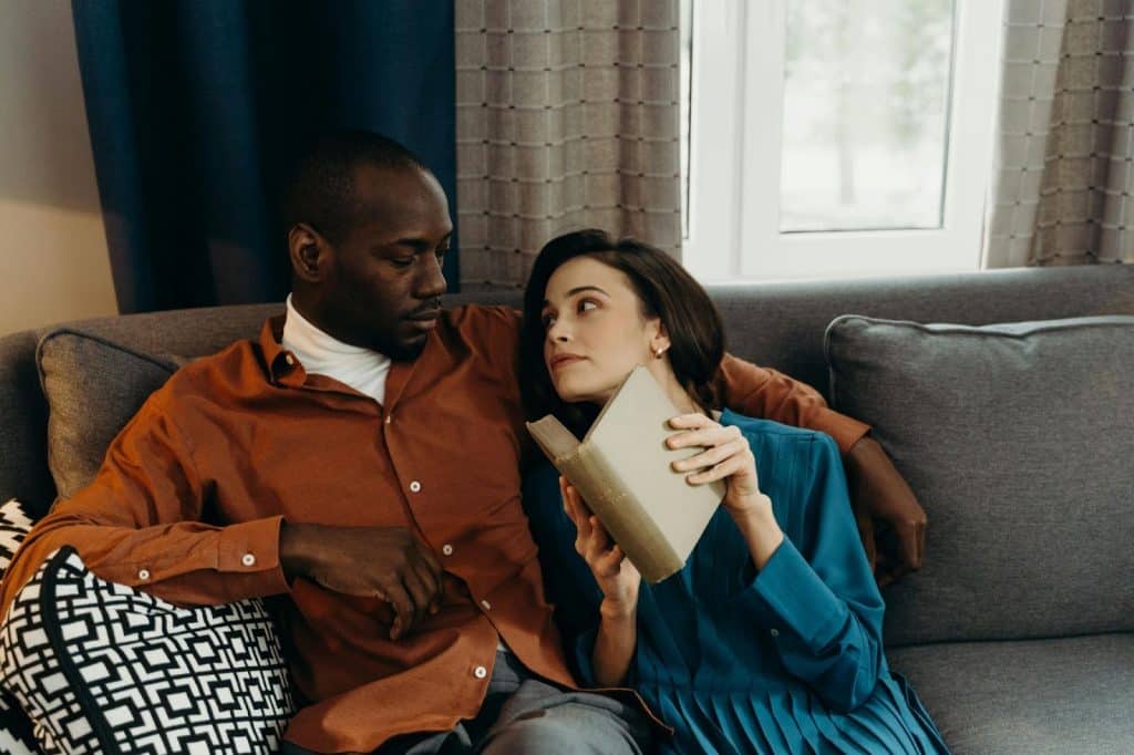 A woman looking at the man