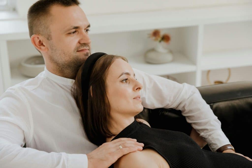 A man and woman at the couch