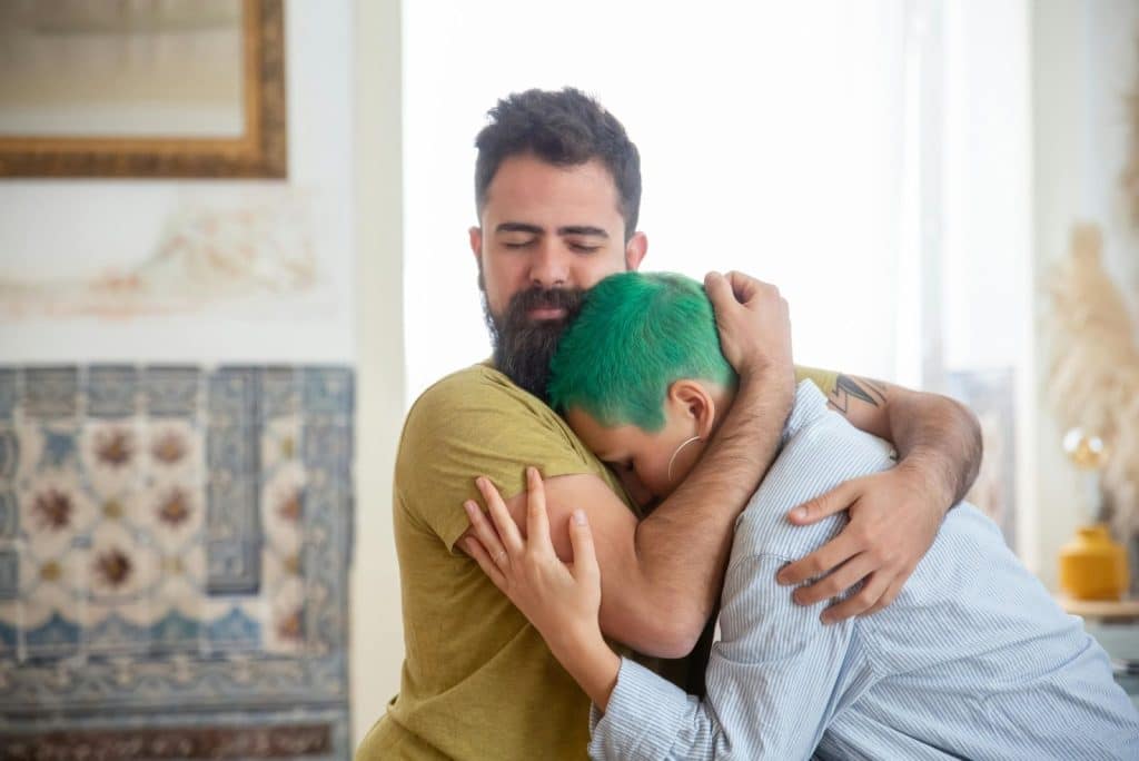 A man and woman hugging