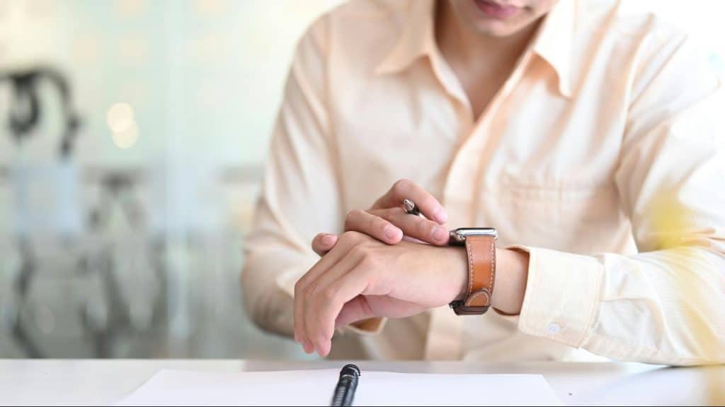 A couple sharing an intimate moment while embracing outdoors.